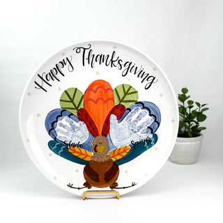 Decorative plate with a turkey design and 'Happy Thanksgiving' text on a white background.