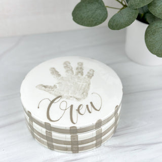 Coaster set decorated with gray gingham and a child's handprint 