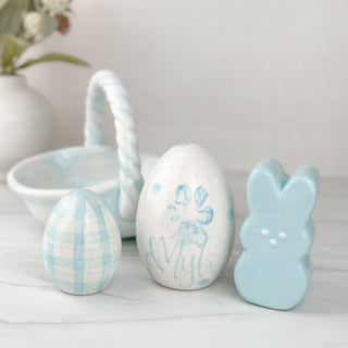 blue floral eggs and bunny made with a dog's paw print. 
