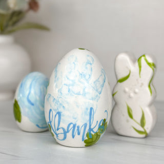 Blue floral eggs and bunny made with a child's handprint. 