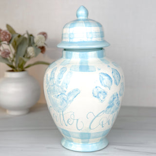 Blue gingham ginger jar with a child's handprint and dog's paw print. 