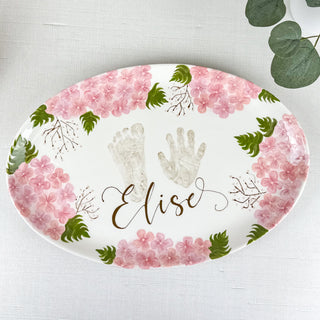 Floral platter with pink flowers made with a child's hand and foot print. 