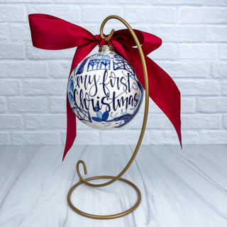 Round ornament decorated with blue chinoiserie and "My First Christmas"