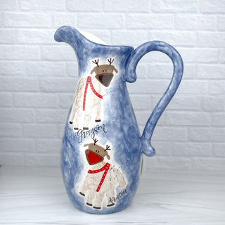 Large pitcher decorated with reindeer made from children's handprints 