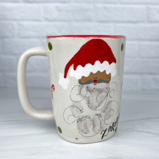 Mug decorated with Santa as a child's handprint.