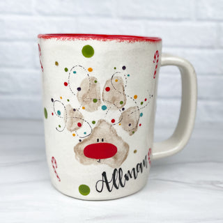 Mug decorated with a reindeer as a dog's paw print.