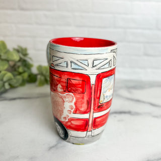 Coffee mug with a red fire truck made with a child's footprint.